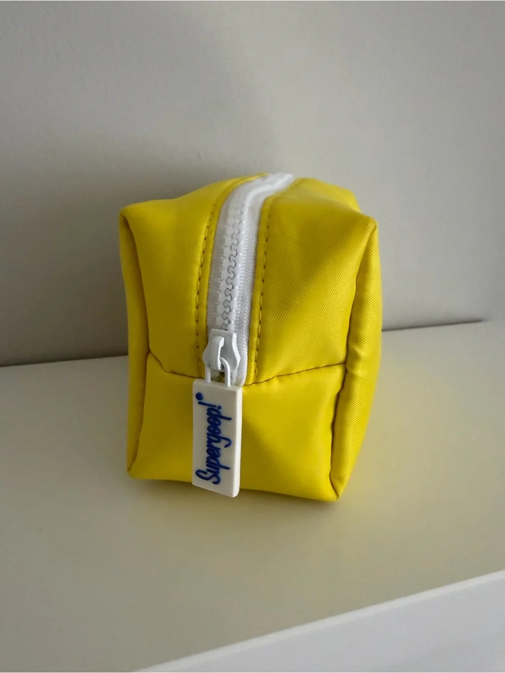 Supergoop Bright Yellow Zipper Pouch